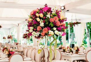 Beautiful fresh wedding flowers including roses hydrangeas and greenery arranged in a lush bridal centerpiece for a wedding celebration