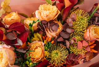 Fresh fall floral arrangement with warm autumn blooms and seasonal decor from Bloomingmore