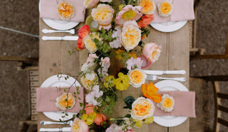 Elegant small wedding floral arrangements featuring garden roses hydrangeas and greenery as refined centerpieces and bridal bouquets for an intimate celebration