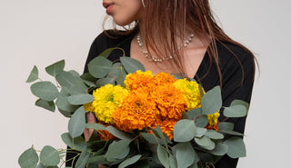 Vibrant fresh orange and yellow marigold flowers in a lush arrangement showcasing their bold color and cultural beauty