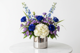 Aquarius zodiac flowers - blue tinted roses, white hydrangeas, fairy roses, lisianthus and delphinium bouquet in a vase - farm-fresh flowers by Bloomingmore