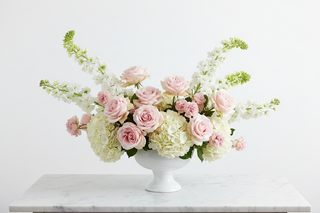 Cancer zodiac flowers - blush roses, white hydrangeas, stock and bells of Ireland bouquet in a vase - farm-fresh flowers by Bloomingmore