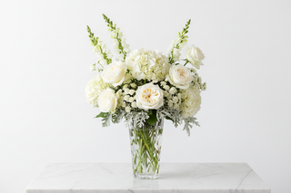 Capricorn zodiac flowers - white garden roses, white hydrangeas, snapdragon and gomphrena bouquet in a vase - farm-fresh flowers by Bloomingmore