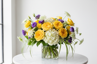 Gemini zodiac flowers - yellow roses, white hydrangeas, lisianthus and ammi majus bouquet in a vase - farm-fresh flowers by Bloomingmore