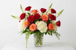 Aries zodiac flowers - Freedom roses, Free Spirit roses, white hydrangeas and snapdragon bouquet in a vase - farm-fresh flowers by Bloomingmore