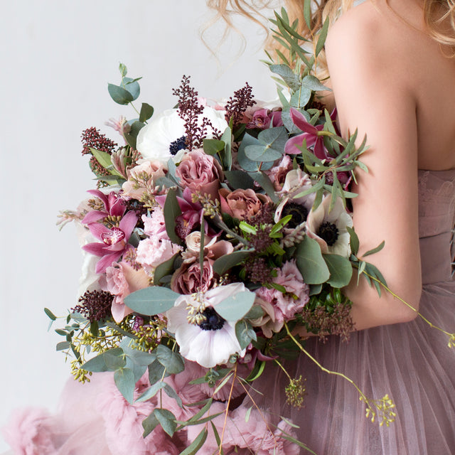 Anemones, Roses, and Eucalyptus floral arrangement